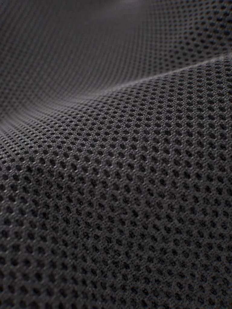 Macro detail of breathable black performance mesh