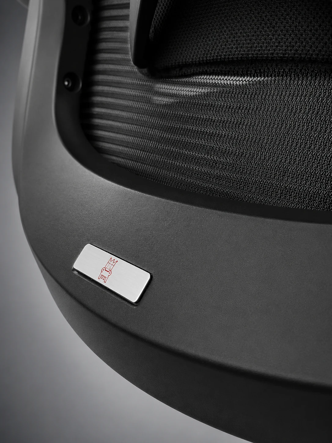 Close-up of finely finished chair mesh, frame and Valhalla Thrones detail plate