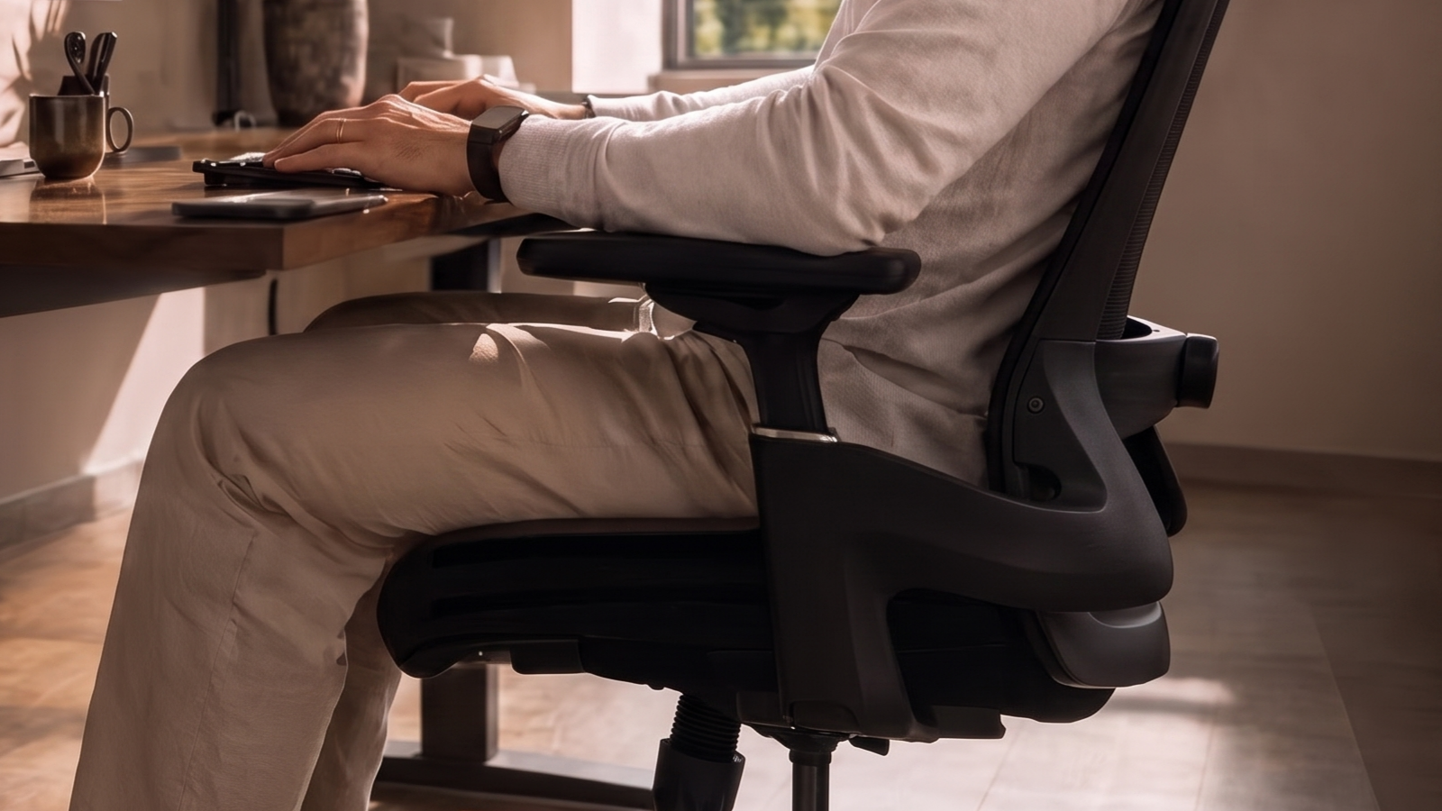Close view of the AVALON armrests beside a desk