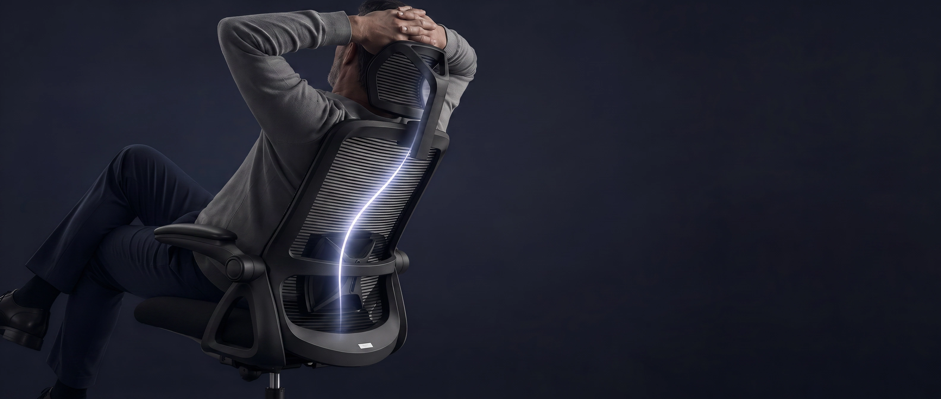 A person reclining in CAPTAIN with illuminated lumbar support