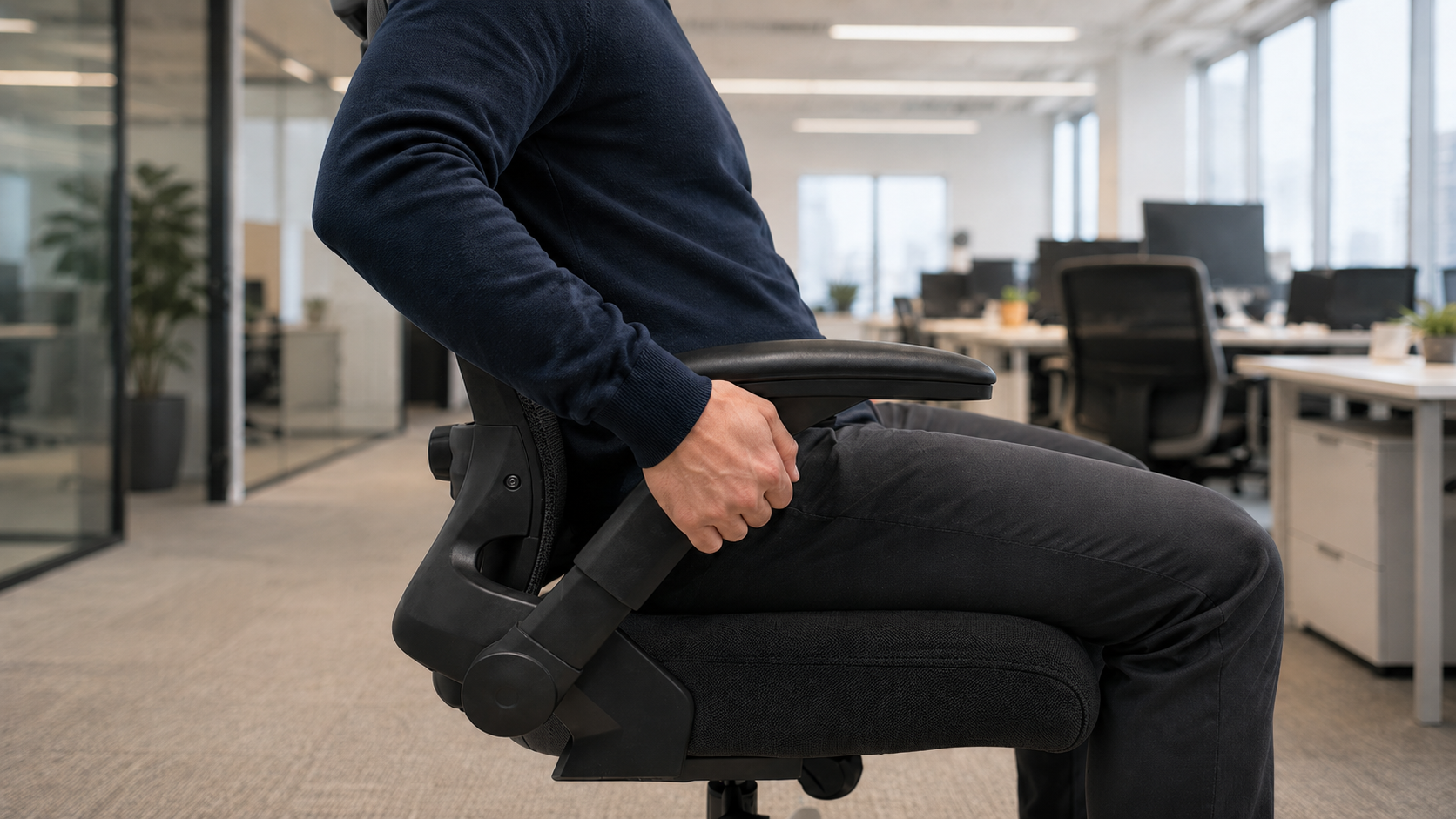 A person raising a VALOUR ergonomic chair armrest