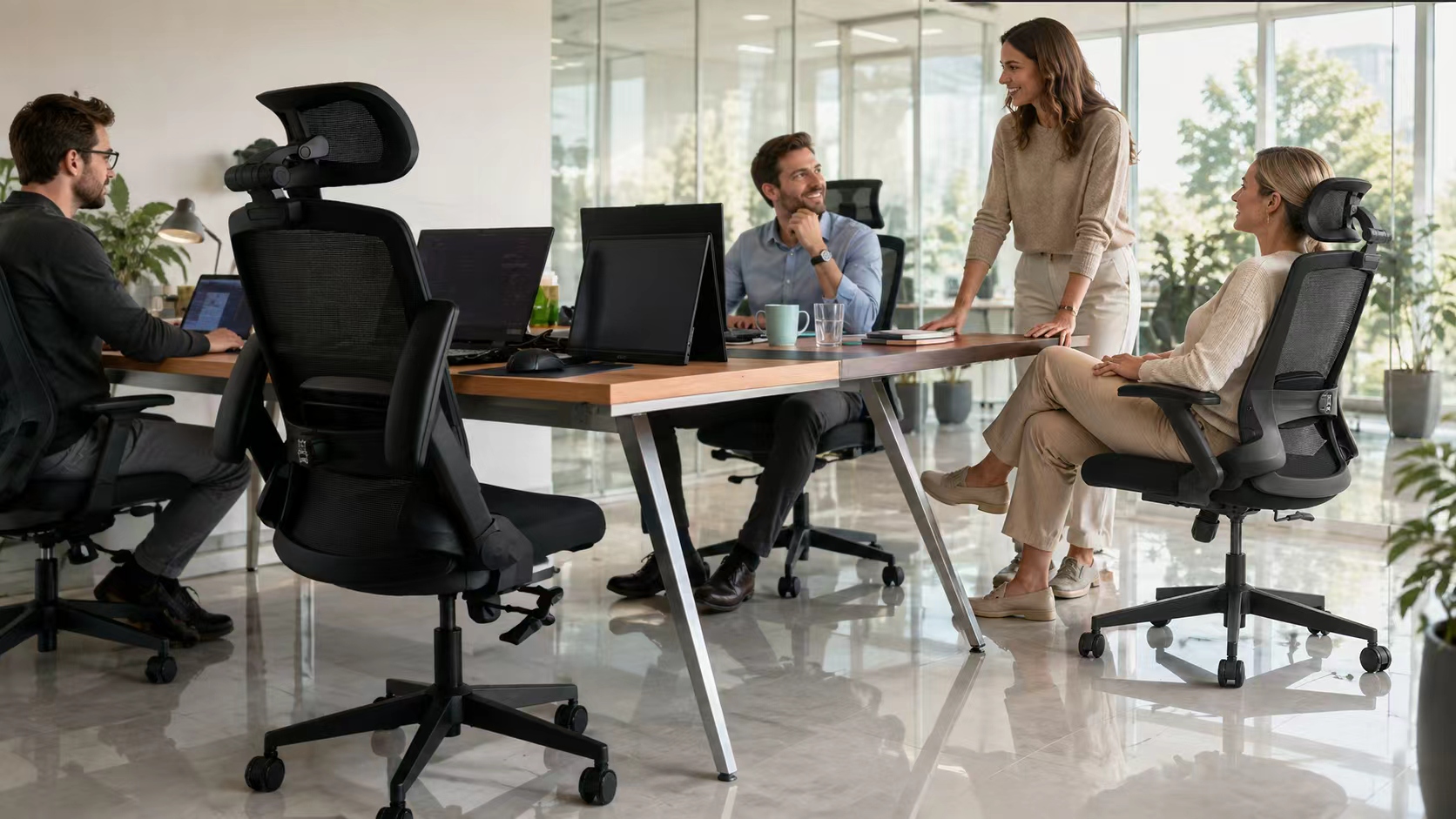 A professional seated in a VALOUR ergonomic chair at a flexible workspace